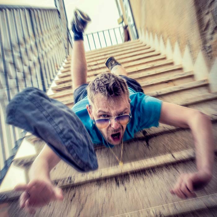 a young man falling down the stairs