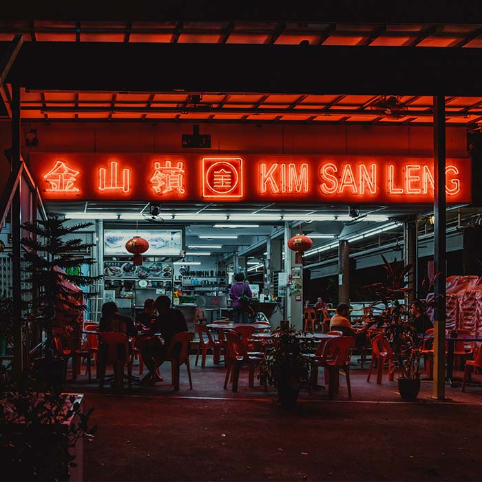 photo of a restaurant with a sign kim san leng outside