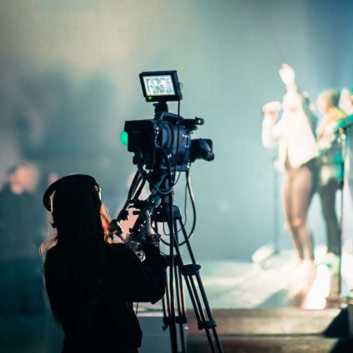 a videographer recording a concert