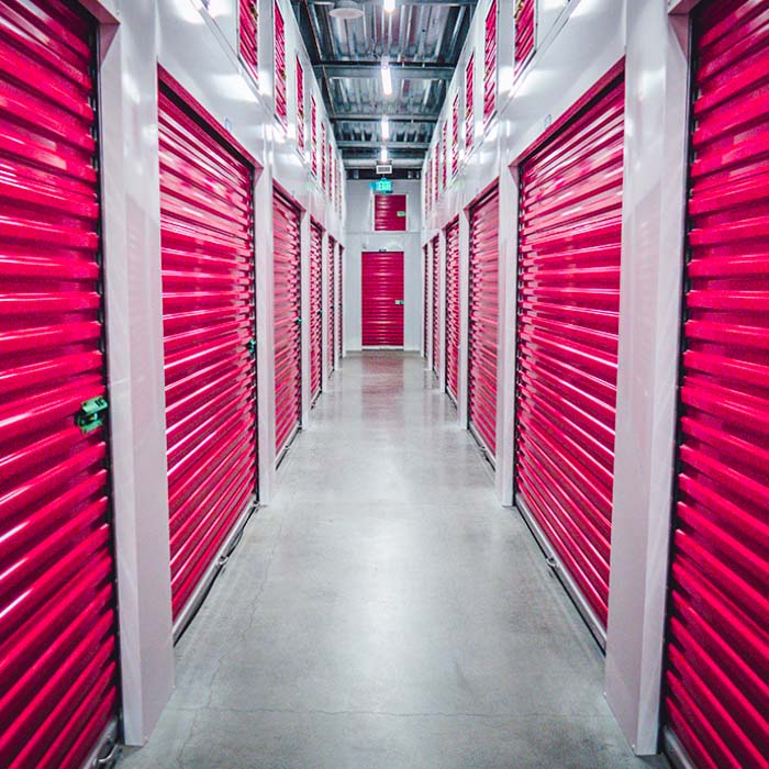 storage containers with red roller doors